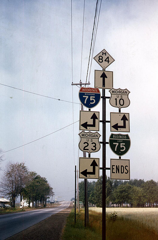 Bay City.  <br><br>

<i>This sign assembly had virtually every basic Michigan route on it, so I stopped and snapped the photo.  This is I-75 Exit 160.  US 10 now begins two miles north at Exit 162.  I-75 and US 23 are still together, and M-84 is unchanged.  The I-75 Business Loop is gone.</i>