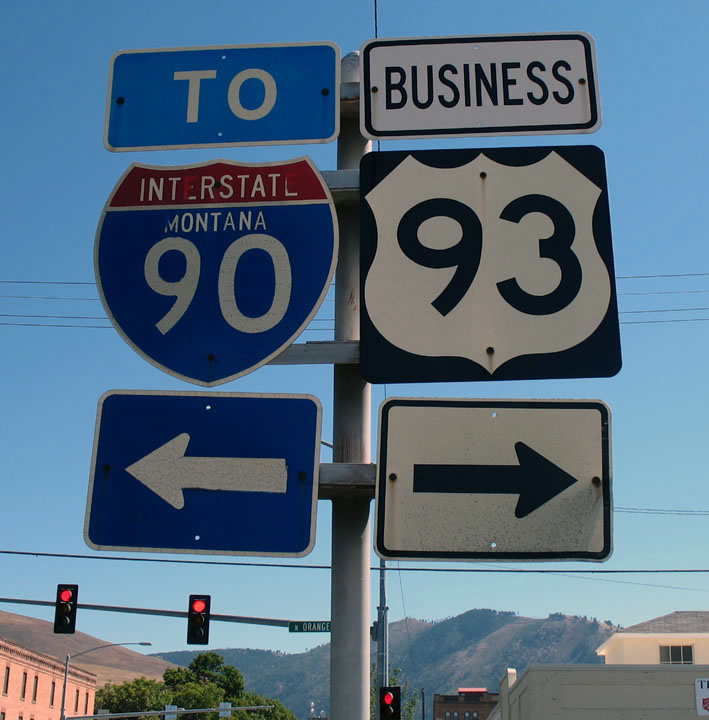 Eastbound Business Loop I-90 approaching Business U.S. 93 (Orange Street) in Missoula.  The interstate shield is gradually losing the letters in the state name.  First