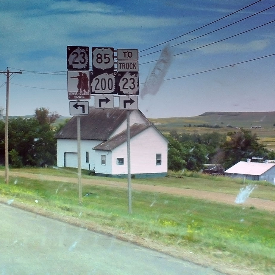 US-85 and state route 200 multiplex for a short while. The windshield shows the deleterious effects of mayfly season (effects primarily deleterious to the mayfly).