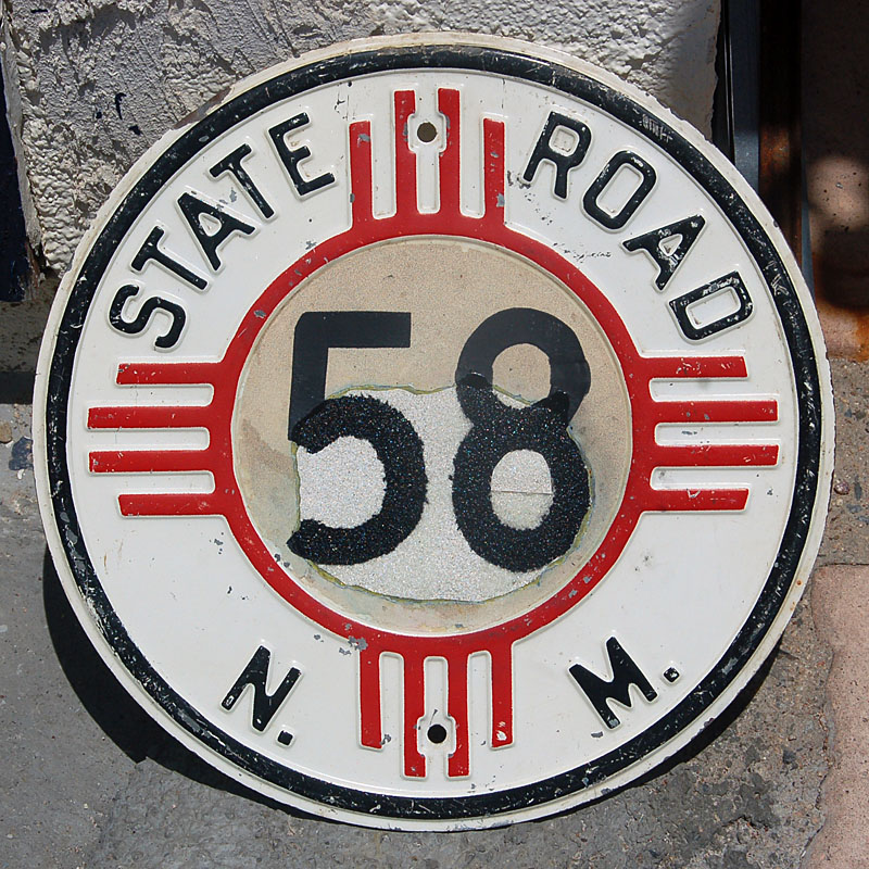 This sign was restored after an unfortunately well-placed bullet destroyed most of the original number. Older block-font blank was done with a round-font number.