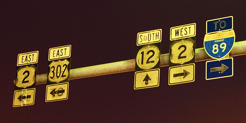 Recycled shields. The two on the right are impossible to discern, but the two on the left are a 4 (under the 2) and a 302 (under the 302). The square shields are 18x18, and the interstate shield is 21x18.