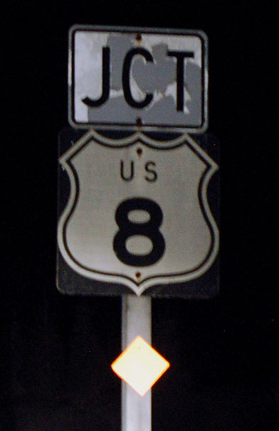 This sign is on aluminum. Wisconsin alternated between wood and aluminum several times after abandoning embossed steel shields during World War II.